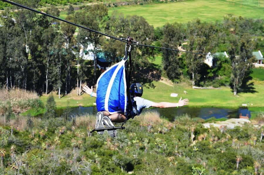 Adrenalin Addo Adventure Park: Superman Zipline - Superman ziplining above Addo’s Sundays River Valley