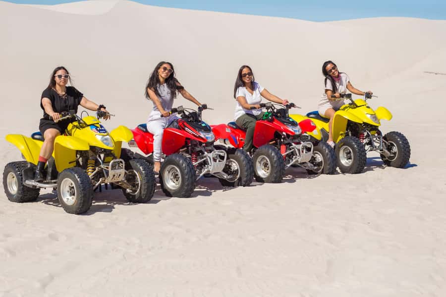 Cape Town: Atlantis Dunes Quad Bike & Free Sandboarding Tour - Sandboarding on tall powdery slopes: your first run matters