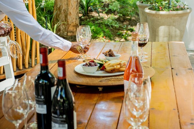 Johannesburg: Wine Tasting and Cableway Half Day Tour - Inside the Indaba Hotel Tasting Room: cheese, guided tastings, and buying bottles