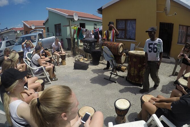 Langa Township and Bokaap Cooking Class Half Day Tour - Getting around with pickup, air-conditioned comfort, and bottled water