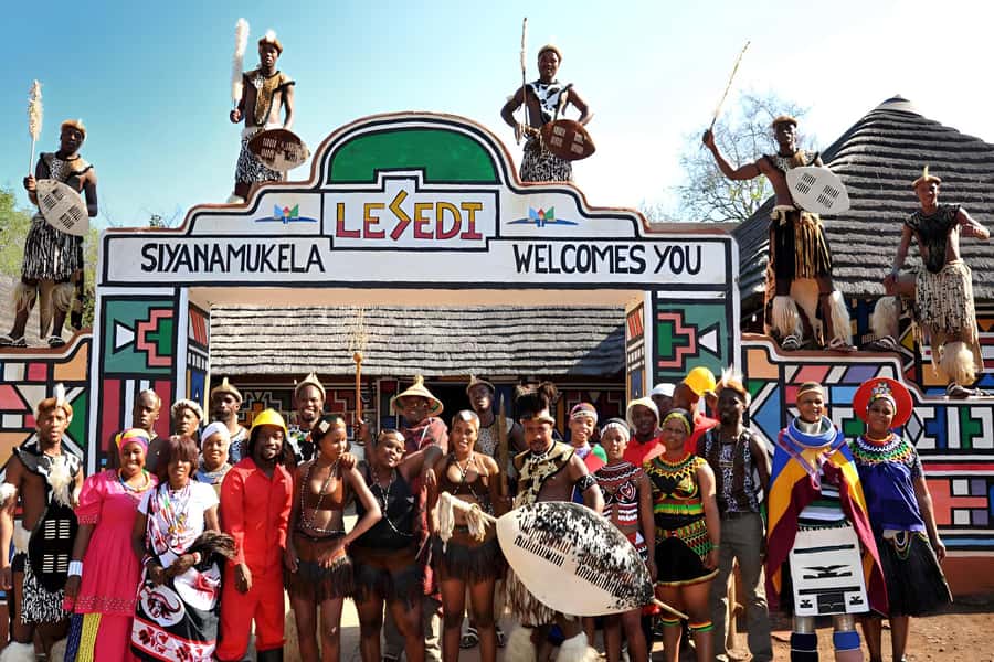 Lesedi Cultural Village with lunch or dinner cultural food - The photo stop and the drumming welcome at the village gate