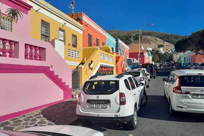 Penguins Boulders Beach and Cape Point Small Group Day Tour - Muizenberg: a short stop with history and colorful beach energy